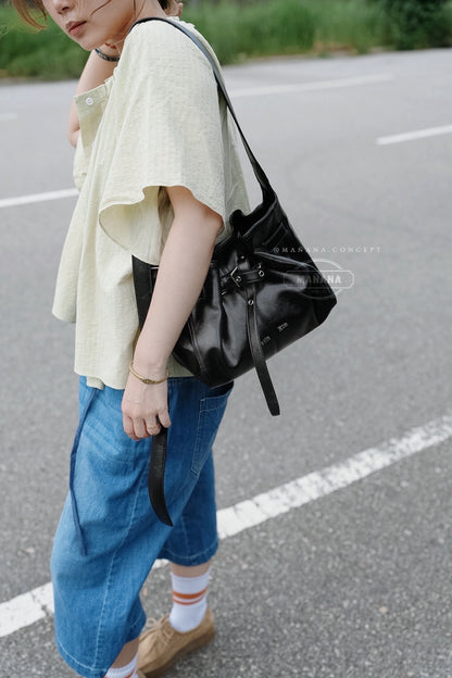 MATIN KIM BELTED VOLUNN BUCKET BAG